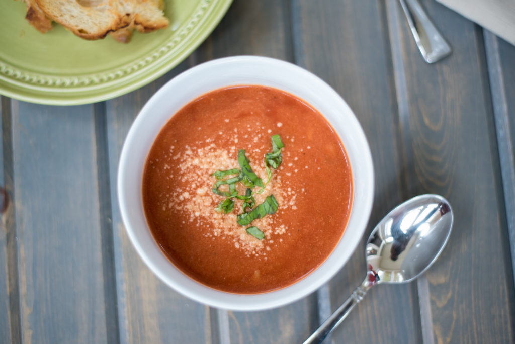 My creamy tomato basil soup is smooth, velvety, + topped with fresh basil and parmesan cheese. The addition of orzo to add just the right amount of texture.