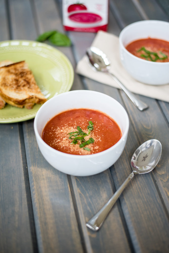 My creamy tomato basil soup is smooth, velvety, + topped with fresh basil and parmesan cheese. The addition of orzo to add just the right amount of texture.