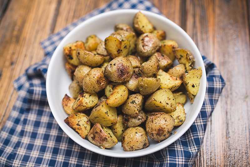 These roasted Yukon gold potatoes are crispy on the outside & soft and creamy on the inside. They are beautifully seasoned and pair well w/ everything. | FirstandFull.com