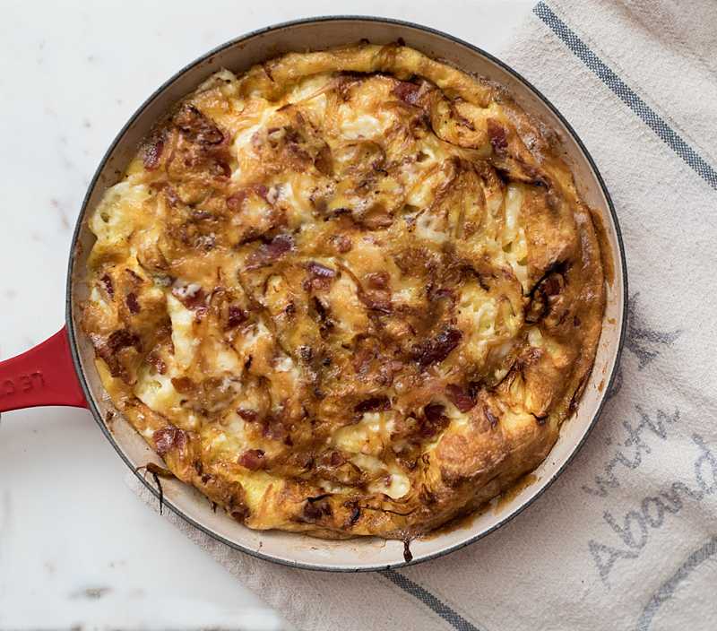 An easy to make frittata with crispy bacon, caramelized onions, and creamy brie cheese. Made it one pan-- brunch can't get any easier! 