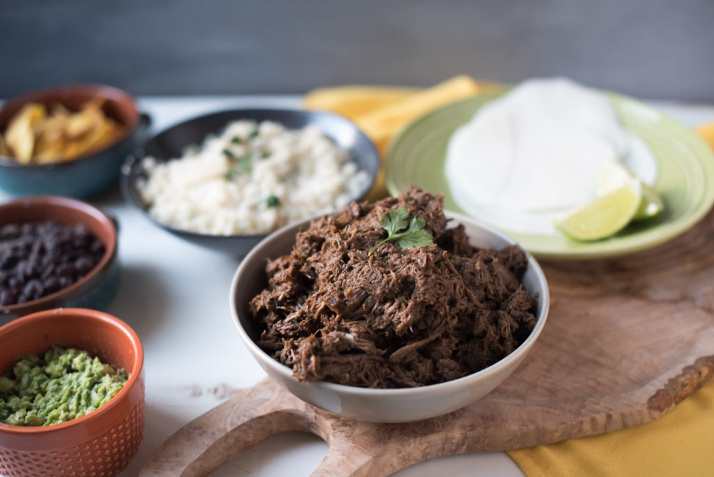 This slow cooker beef barbacoa recipe comes together in 5 minutes and cooks all day or till tender and falling apart. Dinner & leftovers will be delicious! from FirstandFull.com