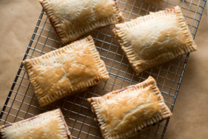 These homemade pop-tarts are flavorful and made with REAL ingredients. I stuck with a homemade pie crust, easy cherry berry jam and light glaze. 