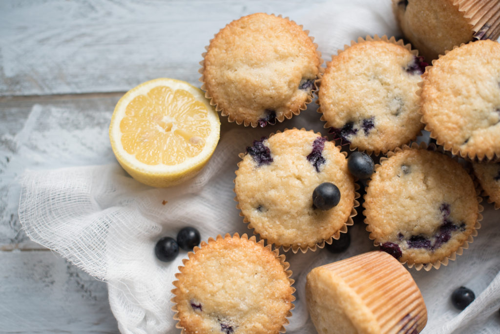 Blueberry Lemon Muffins bursting with fresh blue berries, a light lemon flavor tucked in the fluffiest muffin! The ULTIMATE breakfast/ brunch muffin!