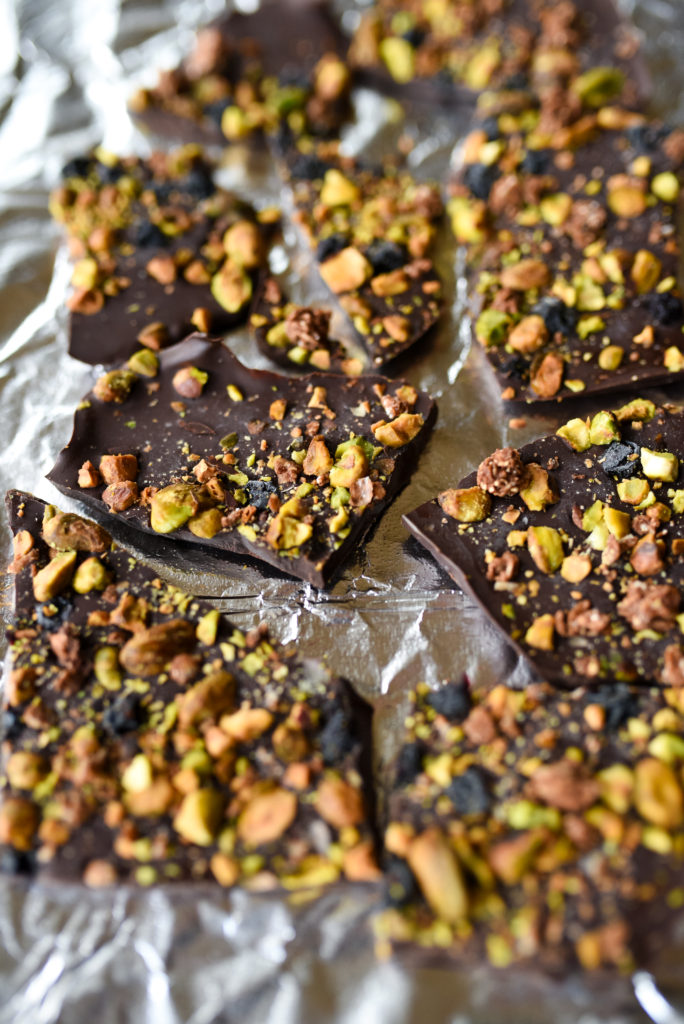 5 minute recipe for Dark Chocolate Pistachio Bark with dried blueberries, tasty pistachios, and crunchy granola. Tips for customization included! | firstandfull.com 