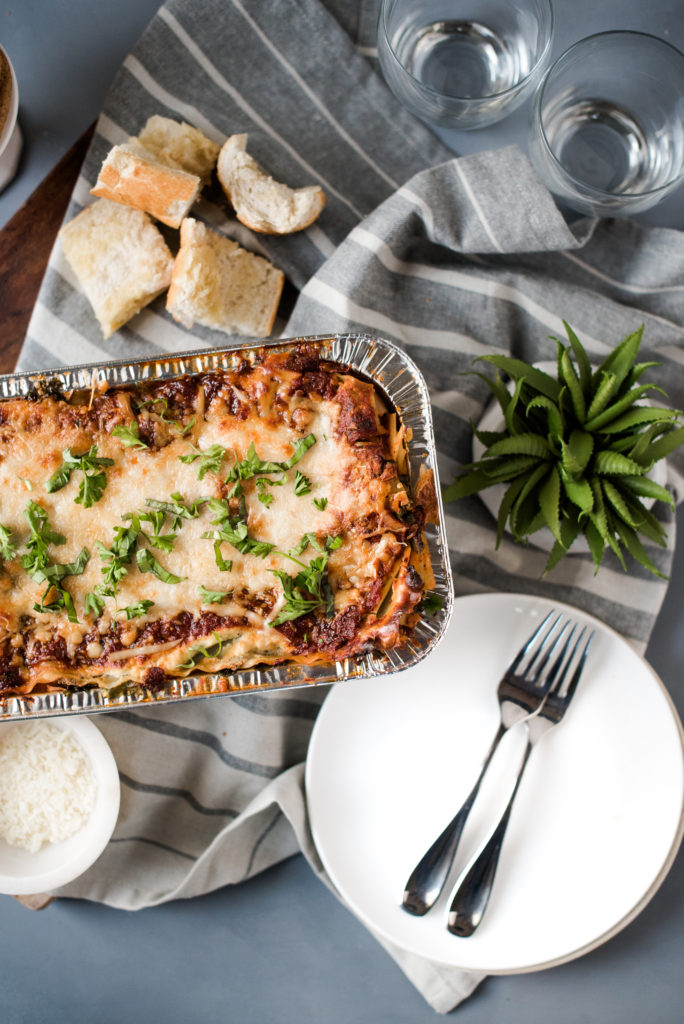 Vegetarian spinach lasagna recipe; layers stuffed with spinach and kale, a savory ricotta, and layered with mozzarella cheese. Make one for the freezer for an easy weeknight meal. 