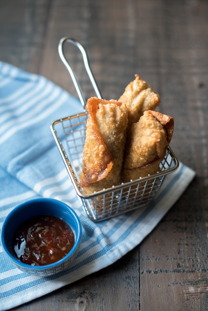 Philly Cheesesteak Egg Rolls with thinly sliced steak, seasoned peppers and onions, and creamy cheese sauce. Famed Del Frisco's Grille CopyCat recipe.