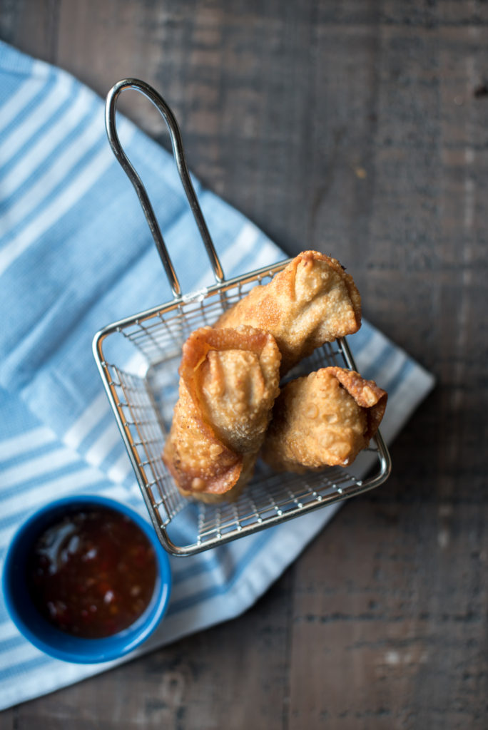 Philly Cheesesteak Egg Rolls with thinly sliced steak, seasoned peppers and onions, and creamy cheese sauce. Famed Del Frisco's Grille CopyCat recipe.