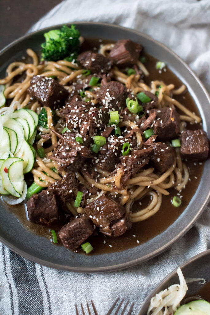 This amazing Chili Garlic Beef NEEDS to be added to your weeknight meal rotation. It's savory, a little spicy and perfect served on rice with steamed veggies. It's made in the instant pot but slow cooker instructions included.