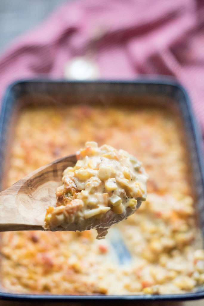 This jalapeno cheesy corn is the perfect side dish for your next BBQ, potluck, or Sunday dinner-- creamy corn with diced jalapenos and sharp cheddar cheese!