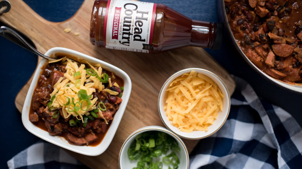   BBQ Chili with ground beef, smoked sausage, and chopped brisket will really elevate your next tailgate. Addition of bbq sauce adds a new depth of flavor!