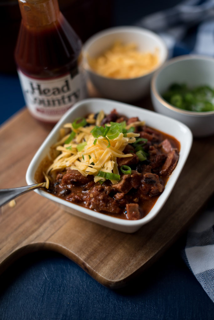   BBQ Chili with ground beef, smoked sausage, and chopped brisket will really elevate your next tailgate. Addition of bbq sauce adds a new depth of flavor!