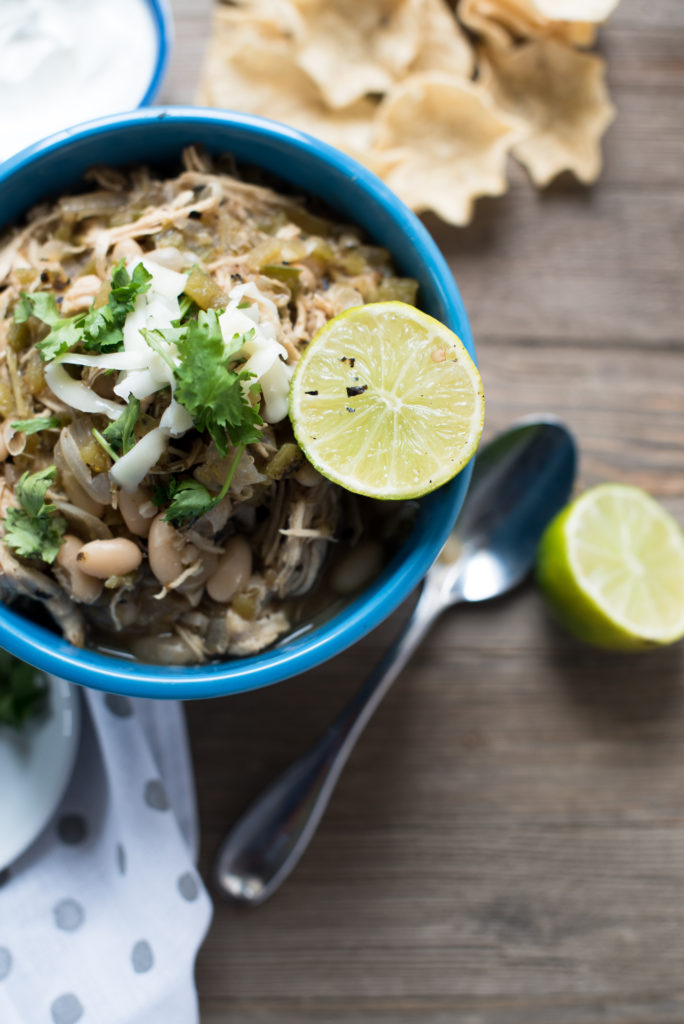 White Chicken Chili: Light, Flavorful soup with white beans, tender shredded chicken, roasted peppers, topped w/ cilantro, cheese, avocado, and lime juice.