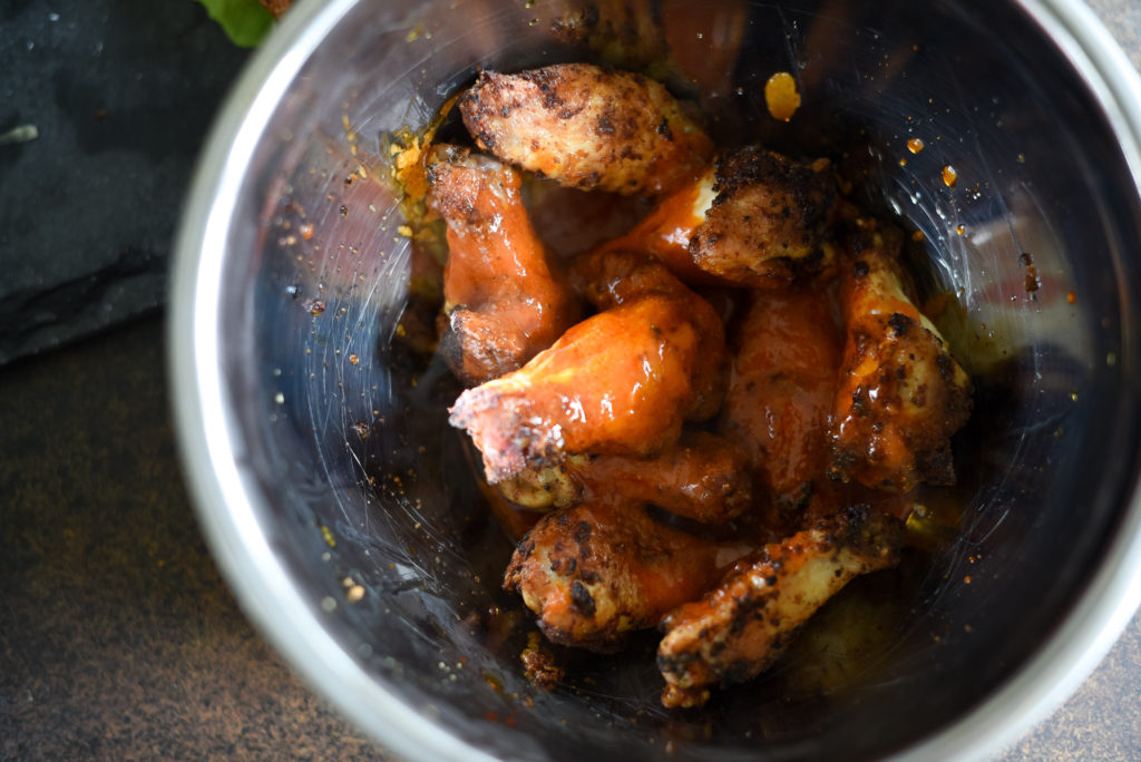 Traditional hot wings with a little zing! Crispy Lemon Pepper Buffalo Wings seasoned with lemon garlic seasoning, tossed with a traditional buffalo wing sauce served with a squeeze of lemon juice. 