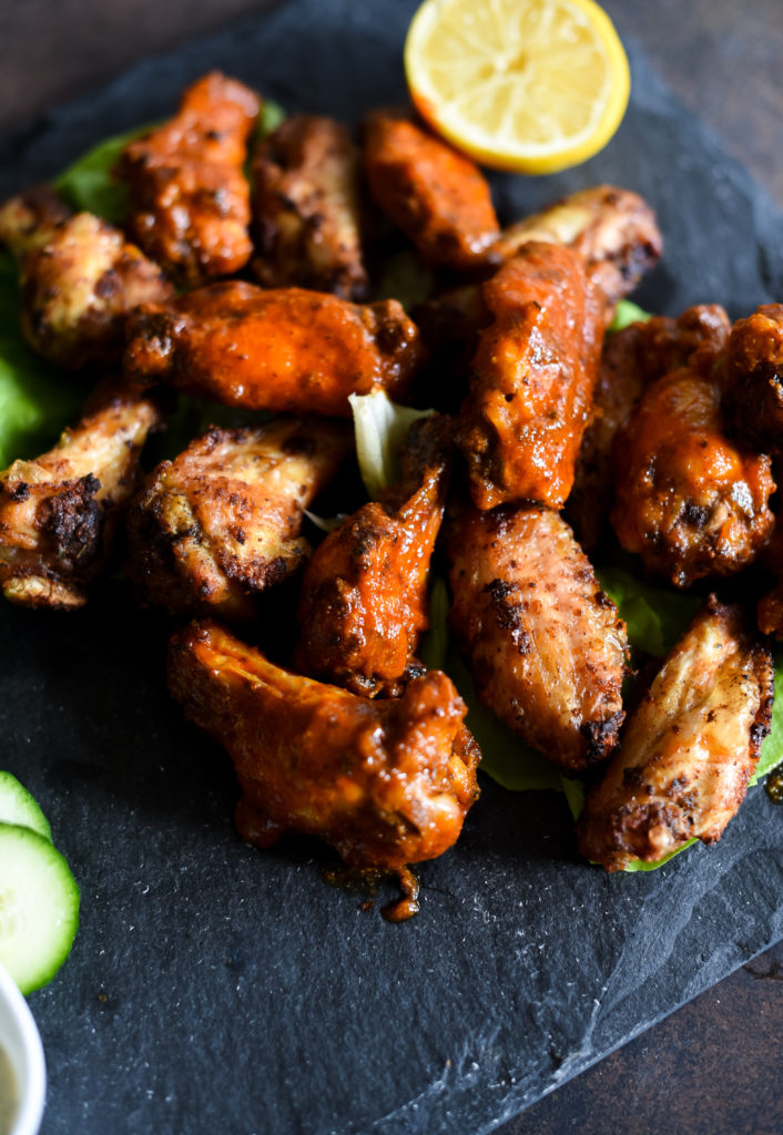 Traditional hot wings with a little zing! Crispy Lemon Pepper Buffalo Wings seasoned with lemon garlic seasoning, tossed with a traditional buffalo wing sauce served with a squeeze of lemon juice. 