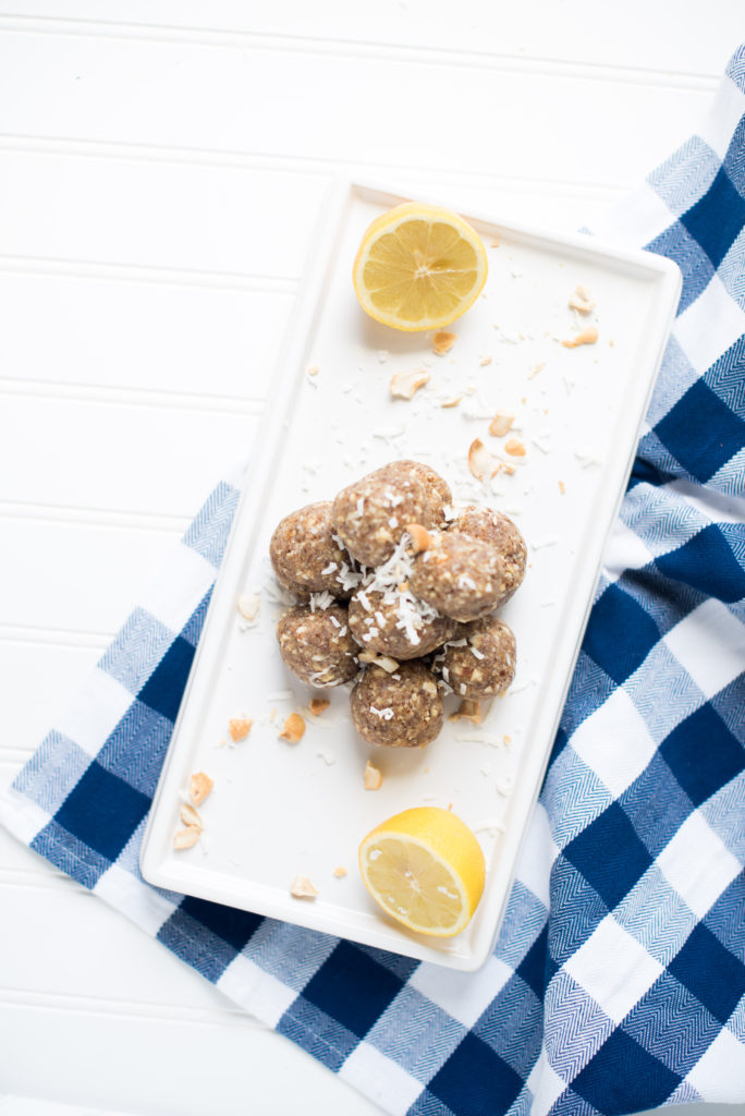 The perfect portable snack: Lemon Cookie Bliss Balls sweetened with dates and made with the perfect combination of nuts and coconut flakes.